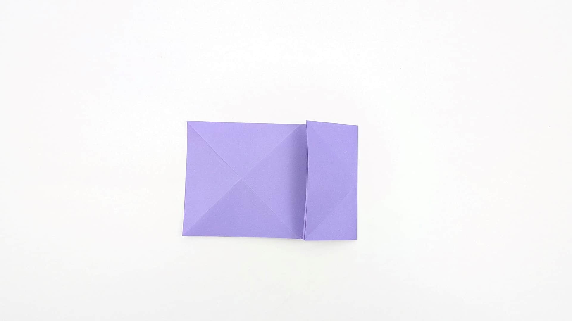 Fold the right panel over to the left, like turning a page. A smaller rectangular section remains on the right side.