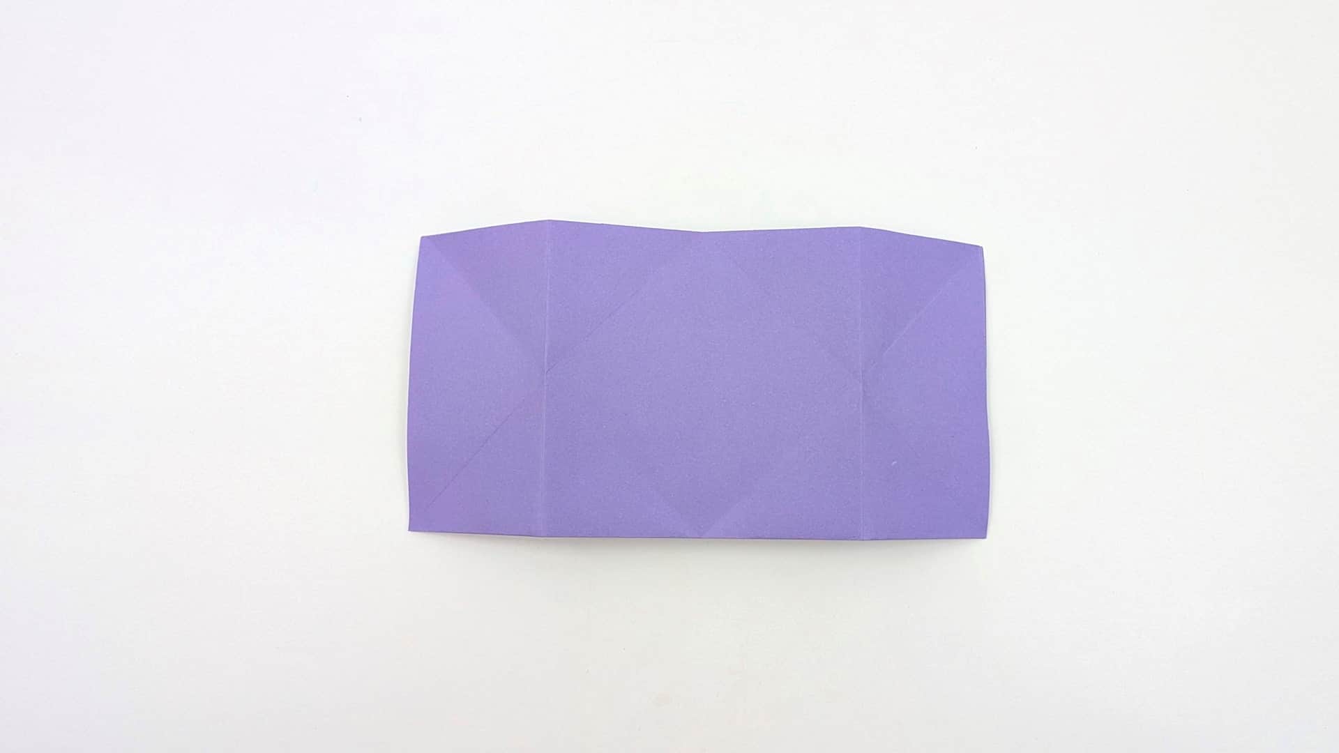 Flatten the paper down so it is horizontal and compact. All creases from both sides are visible — this is your complete crease reference.