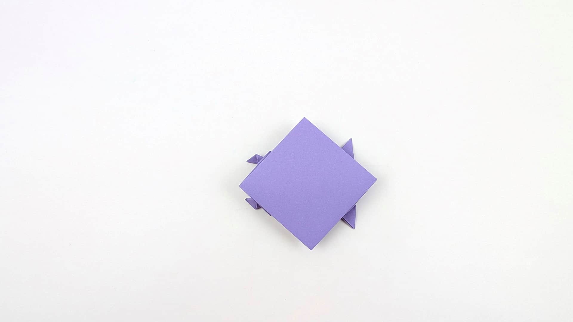 Flip the model over. From this side it appears as a large flat square or rhombus with tiny corner protrusions at two corners.