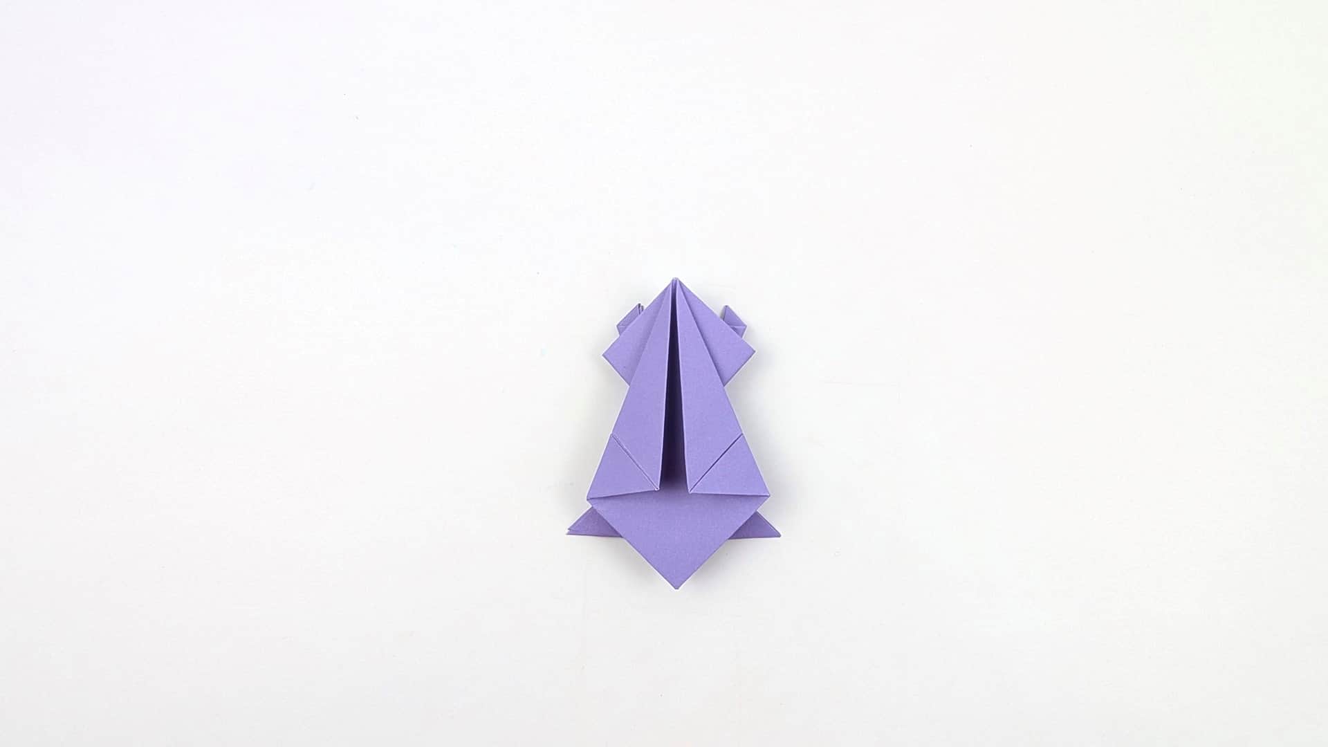 The frog shape is now clear: a pointed head at the top, two front legs spread wide to the sides, and two back legs pointing downward.