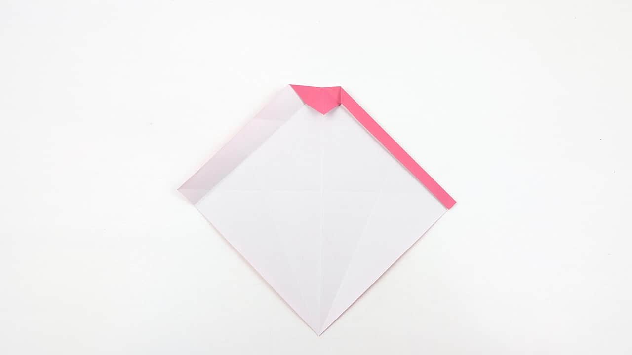 Fold the right edge inward toward the center, leaving a white border on the outside.