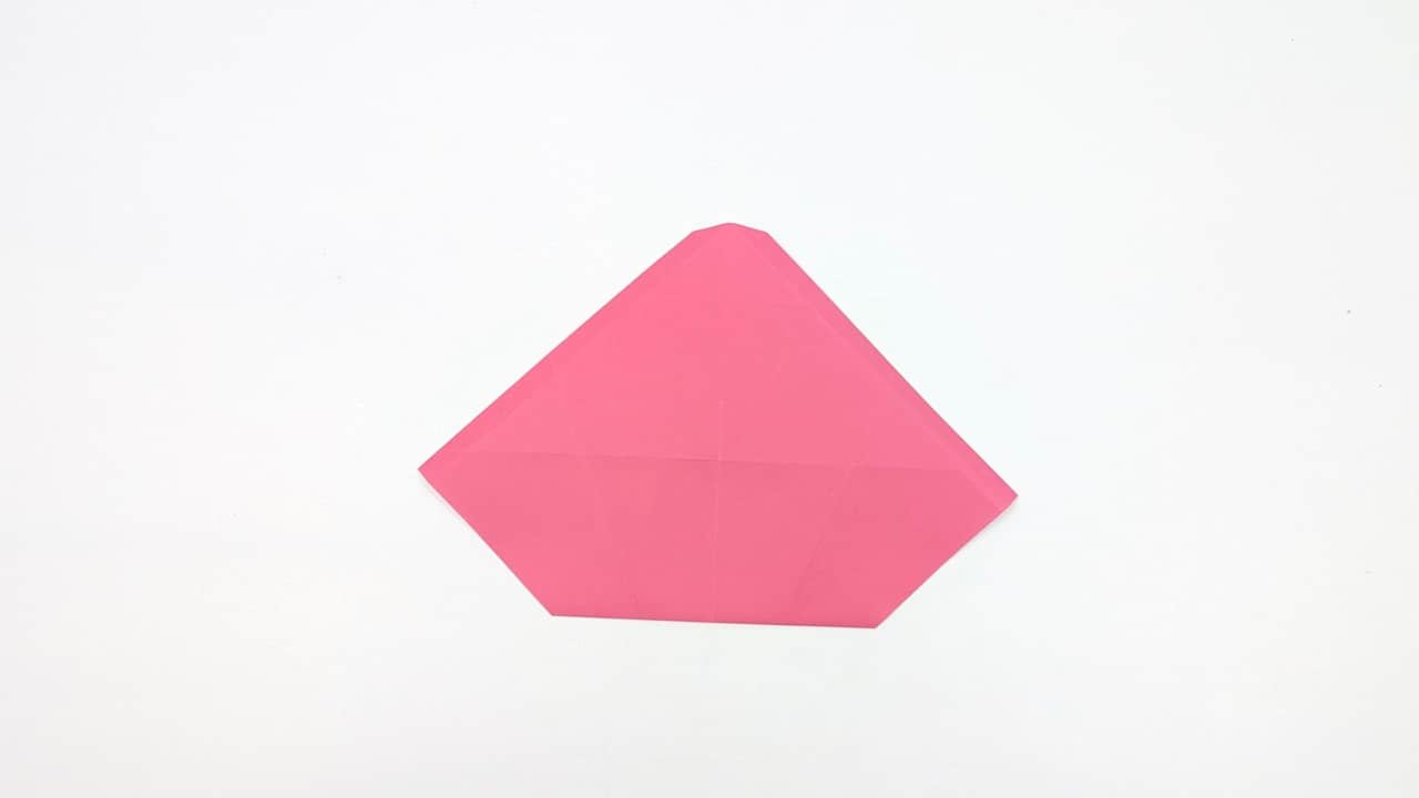 Fold the model in half vertically, bringing the right half behind the left.