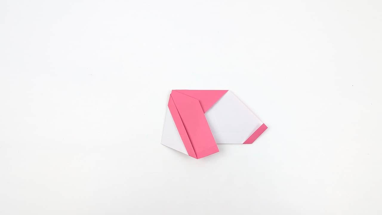 Hold the model by the body and gently pull the head upward and forward.