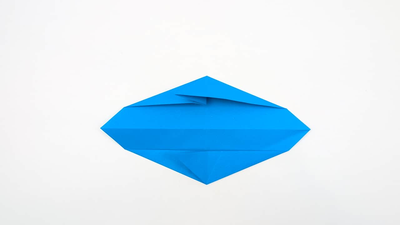 Fold the bottom left point up to the top, aligning it with the center crease.