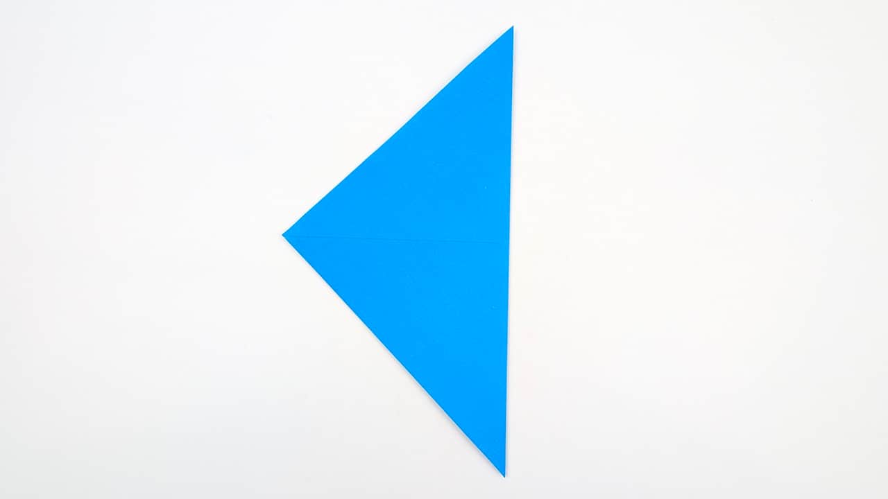 Fold the paper in half diagonally in the other direction. Crease and unfold.