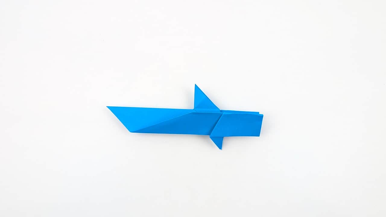 The shark model laid flat horizontally — the dorsal fin rises from the back, and the body tapers from wide gills to a narrow tail.